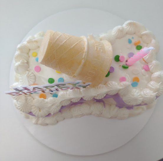 custom dog birthday cake small in a bone shape with cone